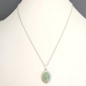 Silver necklace with pale green stone pendant